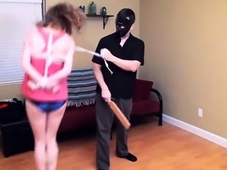 Bound and gagged brunette teen on a leash gets spanked