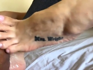 Black dude gets his big cock massaged by lovely white feet