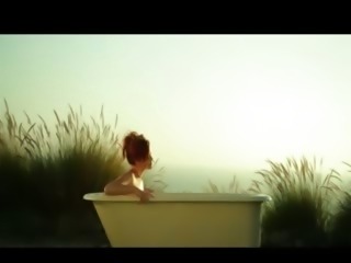 Redhead beautiful babe posing in tub