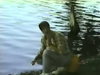 Adorable classic brunette sucking small prick by the lake