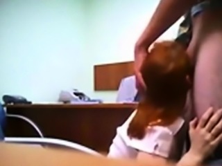 Hidden cam catches redhead in quick office fuck